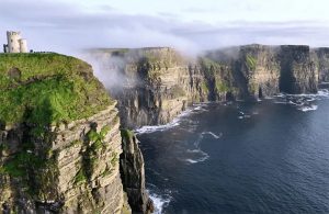 Cliffs of Moher and the BurrenThe Cliffs of Moher rises over 700 feet and provides spectacular vistas over the Atlantic Ocean and the Aran Islands. Formed from rock deposited over 300 million years ago, the area is considered a geologic laboratory. At peak season, there are 30,000 pairs of birds living on the cliffs, representing more than 20 species.